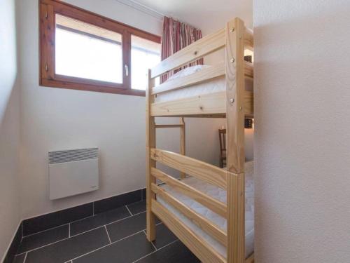 Ein Bett oder Betten in einem Zimmer der Unterkunft Les Aiguilles De Warens