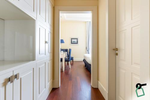 a hallway with a door leading to a bedroom at HOTIDAY Room Collection - Livorno Mascagni in Livorno