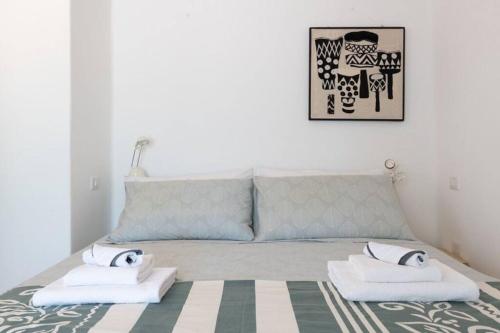 a bedroom with a bed with two towels on it at Trullo Cristiana in Latiano