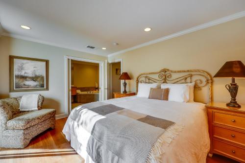 a bedroom with a large bed and a chair at Serene Napa Retreat with Pool Access and Patio! in Napa