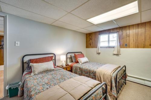 a bedroom with two beds and a window in it at Laramie Vacation Rental 3 Mi to Downtown! in Laramie