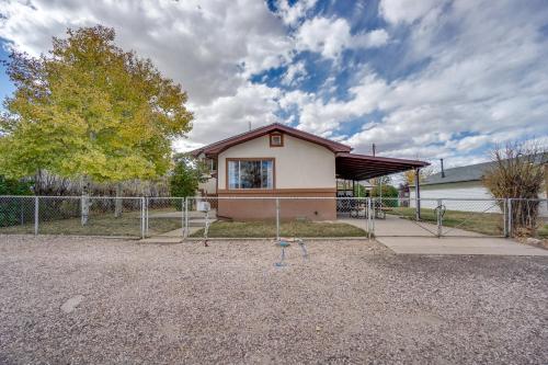 a small house with a fence in front of it at Laramie Vacation Rental 3 Mi to Downtown! in Laramie