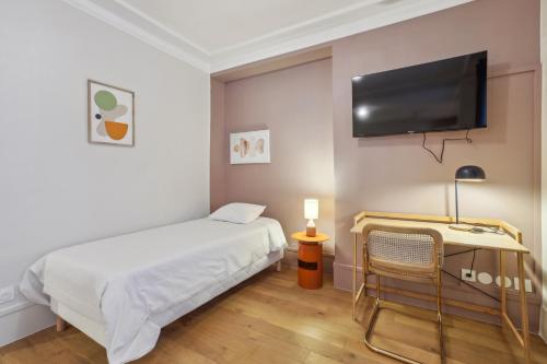 Un ou plusieurs lits dans un hébergement de l'établissement Hôtel Juliette