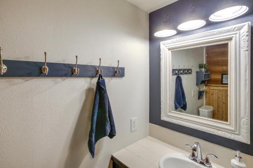 a bathroom with a sink and a mirror at The InnLet - Comfy Cabin By Conkling Marina in Worley