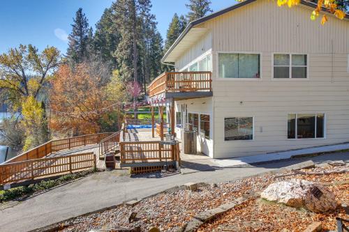 a house with a deck and a building at The InnLet - Comfy Cabin By Conkling Marina in Worley
