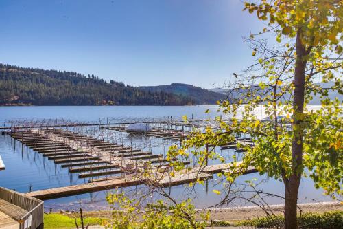a dock on a lake with boats in the water at The InnLet - Comfy Cabin By Conkling Marina in Worley