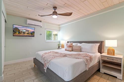 a bedroom with a bed and a ceiling fan at Sea Foam - 173 in Siesta Key