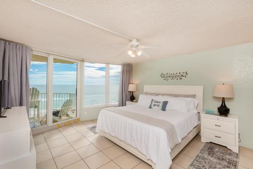 a bedroom with a bed and a view of the ocean at Daytona Beach Shores Ocean Front Balcony 2Beds 2BA King STE and 2Queens - Shores Club 805 in Daytona Beach Shores