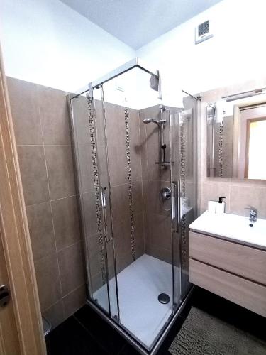 a bathroom with a shower and a sink at Travedona Loft by lake Ixihome in Travedona