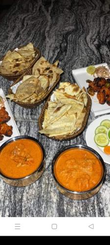 a table topped with different types of food at Hotel ABC Pvt. Ltd. in Bhairahawa