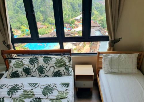 Ένα ή περισσότερα κρεβάτια σε δωμάτιο στο Hotspring 2 Room Suite 1910 with Theme Park View and Netflix 6 pax