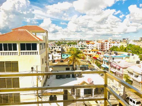 a view of a city from a balcony at LA VlTA E' BELLA in Los Mameyes