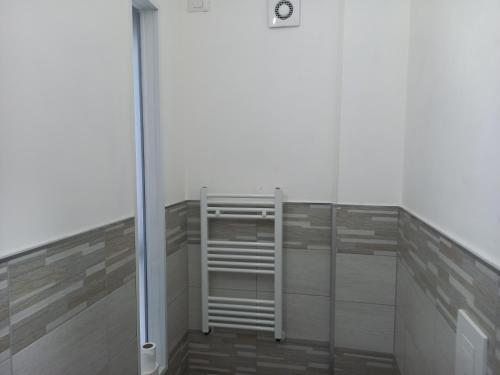 a room with a glass wall with a heater in it at B&B Il canale in Ancona