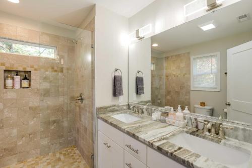 a bathroom with two sinks and a large mirror at Luxury Mountain Home - by Ridgecrest and Asheville! in Black Mountain