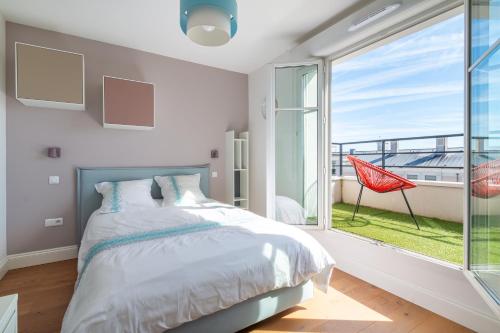 Ένα ή περισσότερα κρεβάτια σε δωμάτιο στο PENTHOUSE Luxe DISNEYLAND PARIS