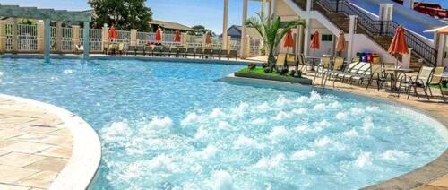 a large pool with blue water in a resort at Lacqua diroma Caldas Novas - Piscinas 24 horas - Apartamento com Cozinha Americana in Caldas Novas