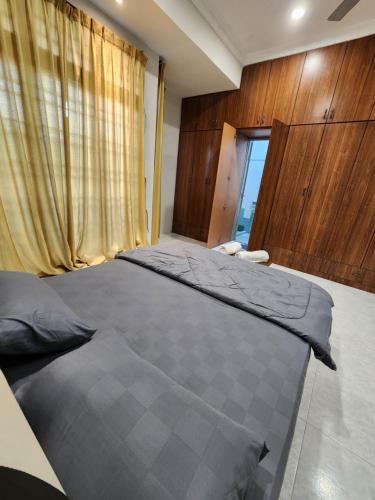 a bedroom with two beds and a window at Galaxy Guest Home by Ipoh Maju Stay in Ipoh
