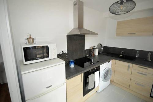 Kuchyň nebo kuchyňský kout v ubytování Le Lodge - Au coeur du village