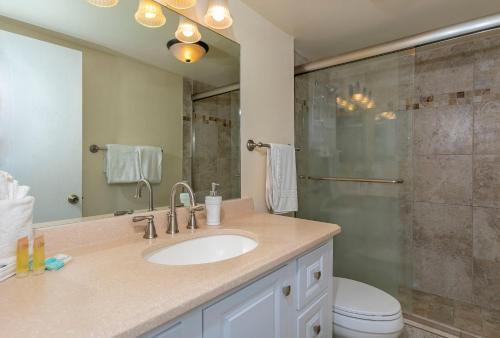 a bathroom with a sink and a shower at Kihei Surfside 307 - MCH in Kihei
