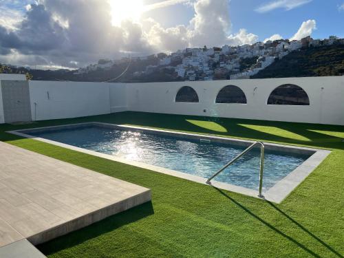 a swimming pool on the side of a building at Casa Nueva in Las Palmas de Gran Canaria
