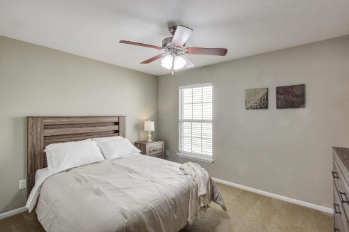 a bedroom with a bed and a ceiling fan at Lovely Lawrence Home - 3 Blocks to KU! in Lawrence