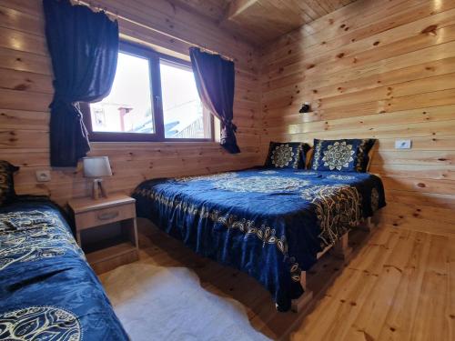 Postel nebo postele na pokoji v ubytování Stone Lodge 3