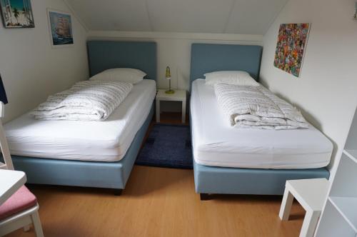 Postel nebo postele na pokoji v ubytování Kustverhuur, Park Scheldeveste , Schelde 095