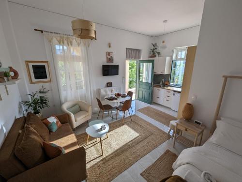 a living room with a couch and a table at The Valkyries 1 in Leonidio
