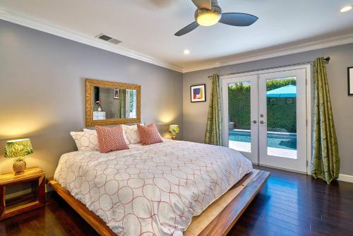 a bedroom with a bed and a ceiling fan at Pineapple Splash! Complete Privacy! Salt Pool! in Palm Springs