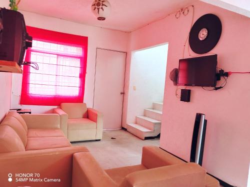 Coin salon dans l'établissement Hermosa casa a un paso del mar! Las mejores vacaciones para todos!!!!