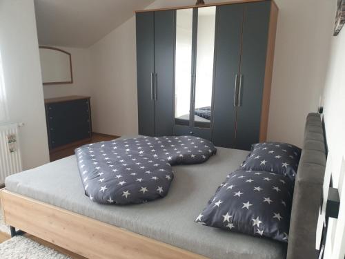 a bed with two pillows on it in a room at APARTMAN SOFIA in Županja