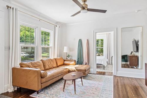 a living room with a couch and a ceiling fan at Charming House 5 Minutes to Downtown Chattanooga and Aquarium in Chattanooga
