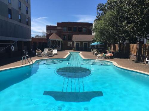 a large swimming pool with blue water at Famous Music Row Presidential Suite 2 Bedroom, 2 Bathroom, 4 Beds in Nashville