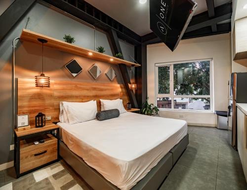 Ein Bett oder Betten in einem Zimmer der Unterkunft One Apartments Laureles