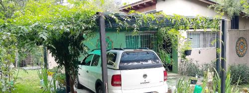 a white van parked in front of a house at CABAÑA MI PAZZ camino al cuadrado in Cordoba