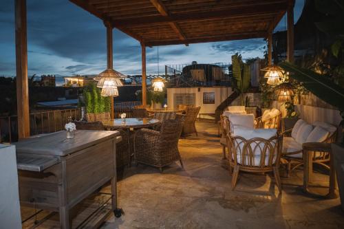 a patio with tables and chairs and lights at Hotel Casa Don Luis by Faranda Boutique, a member of Radisson Individuals in Cartagena de Indias