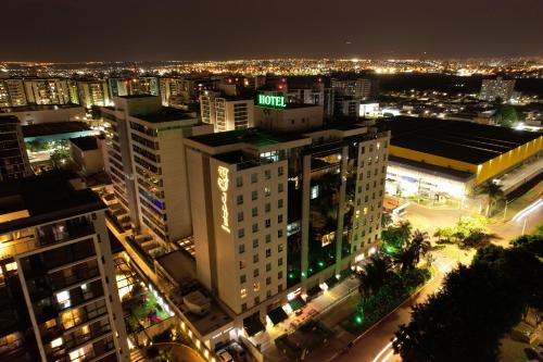 a view of a city at night with lights at Jade Hotel Brasília in Brasília