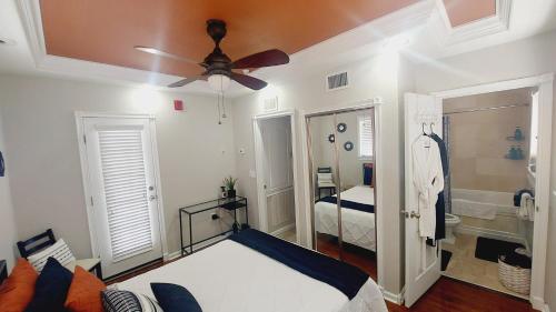 a bedroom with a bed and a ceiling fan at The Hipster Studio in DTSP in St Petersburg