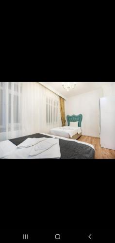 two beds in a room with two beds sidx sidx sidx at 3 FLOOR OLD CITY 1 in Istanbul