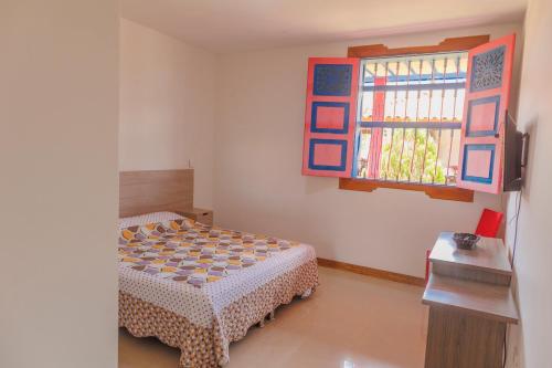 Voodi või voodid majutusasutuse Hotel Arrayanes del Quindío toas