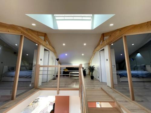 a large room with a skylight in the ceiling at La Maison de Juliette in Le Puy en Velay