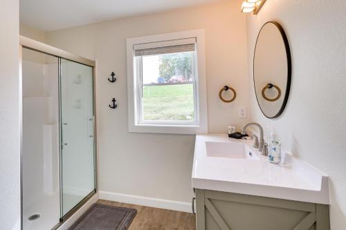 a bathroom with a sink and a mirror at Sunrise Beach Home on the Lake of the Ozarks! in Sunrise Beach