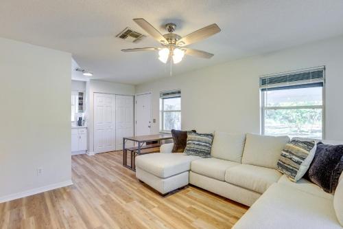 a living room with a couch and a ceiling fan at Williston Home with Yard 6 Mi to Devils Den Spring in Williston