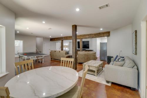 a living room with a table and a ping pong ball at Luxury Lakefront Retreat with Deck and Patio! in Fairfield Bay