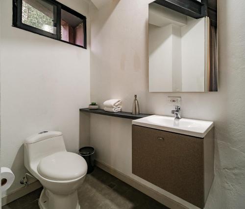 Ein Badezimmer in der Unterkunft One Apartments Laureles