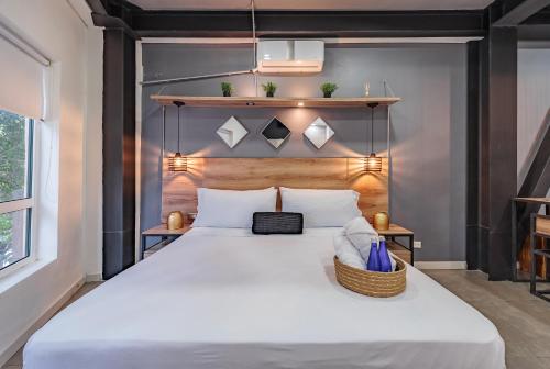 Ein Bett oder Betten in einem Zimmer der Unterkunft One Apartments Laureles