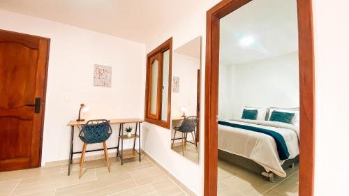 En eller flere senge i et værelse på OCASSO JARDIN APARTAMENTO AZULEJO