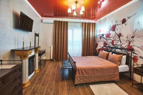 a hotel room with a bed and a fireplace at Готель Ангел на Великій Кільцевій in Kyiv