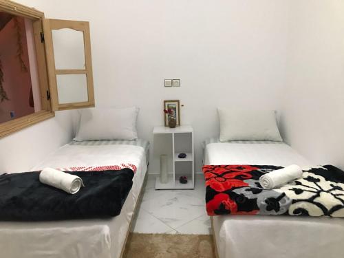 Säng eller sängar i ett rum på Maison d'hôte Riad Tounfite