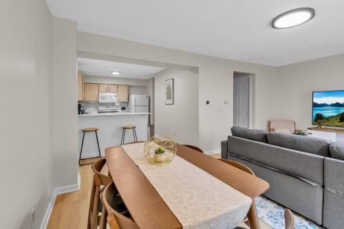 a living room with a table and a couch at Downtown & Upscale in Buffalo
